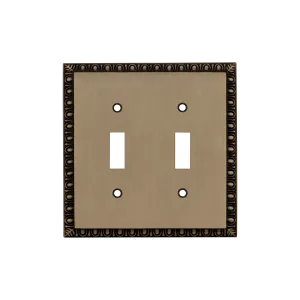 Egg & Dart Switch Plate with Double Toggle in Antique Brass
