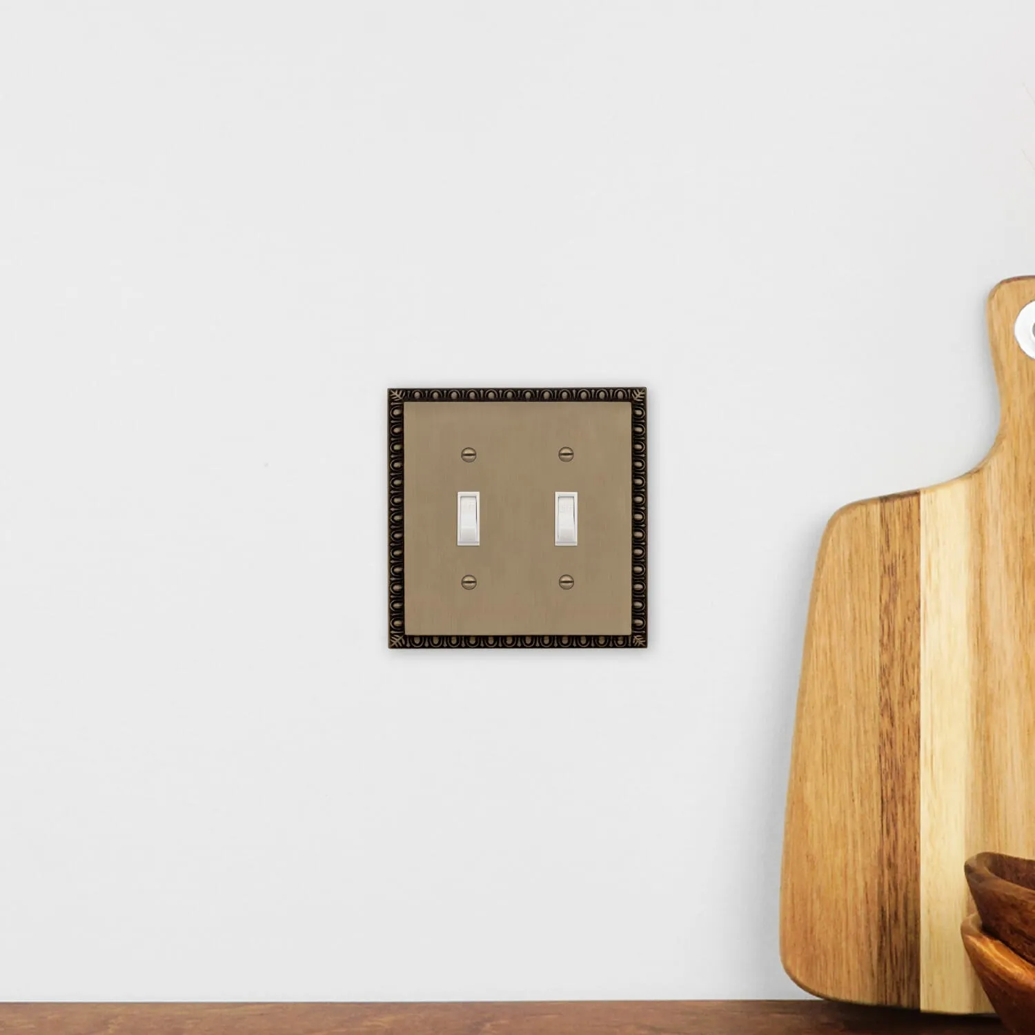 Egg & Dart Switch Plate with Double Toggle in Antique Brass
