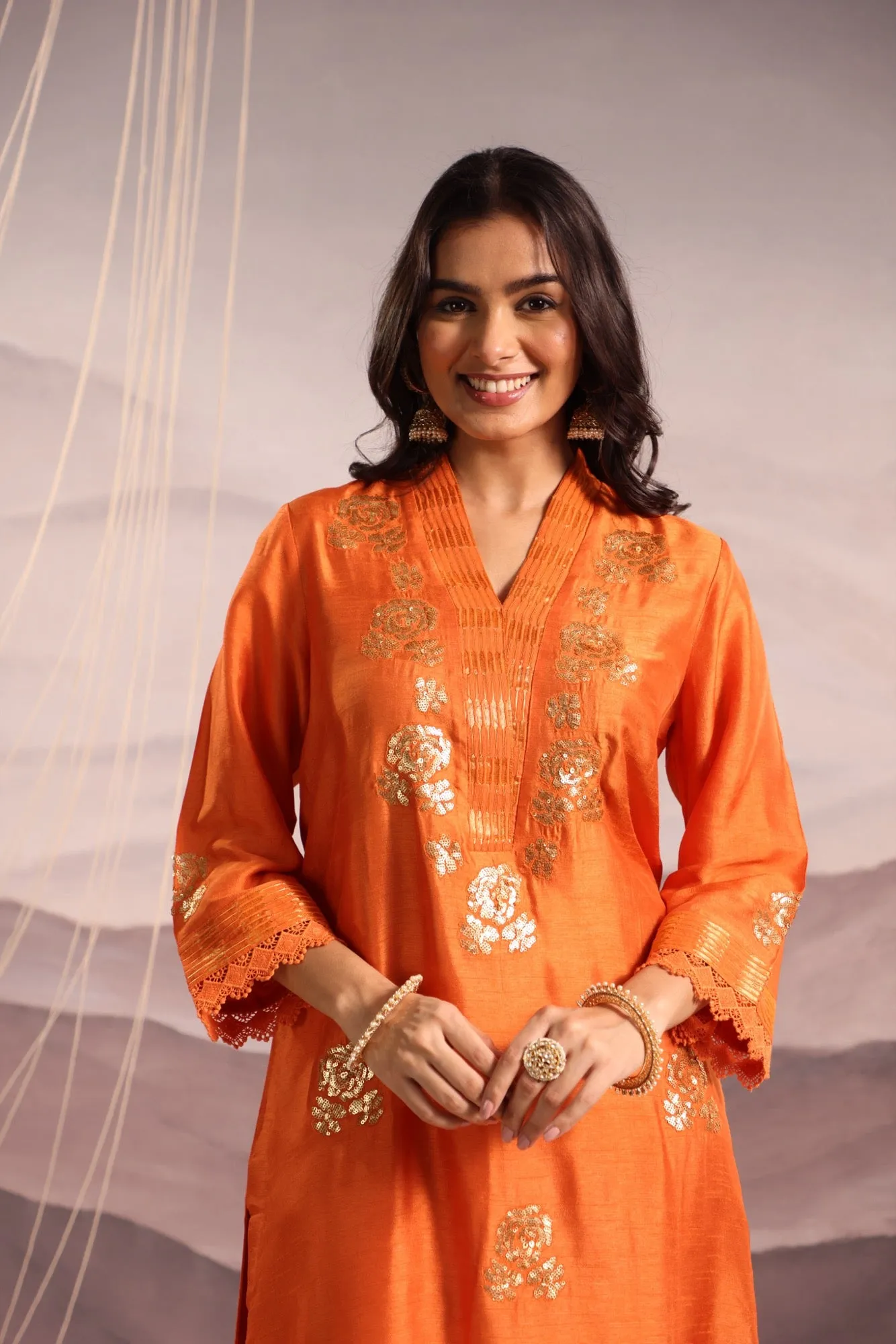 orange embroidered v neck silk kurta set